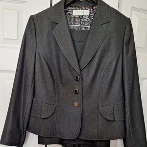 New never worn Tahari suit with peplum back, lots of detail